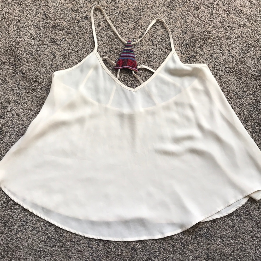 Sheer tank top with very pretty low cut back